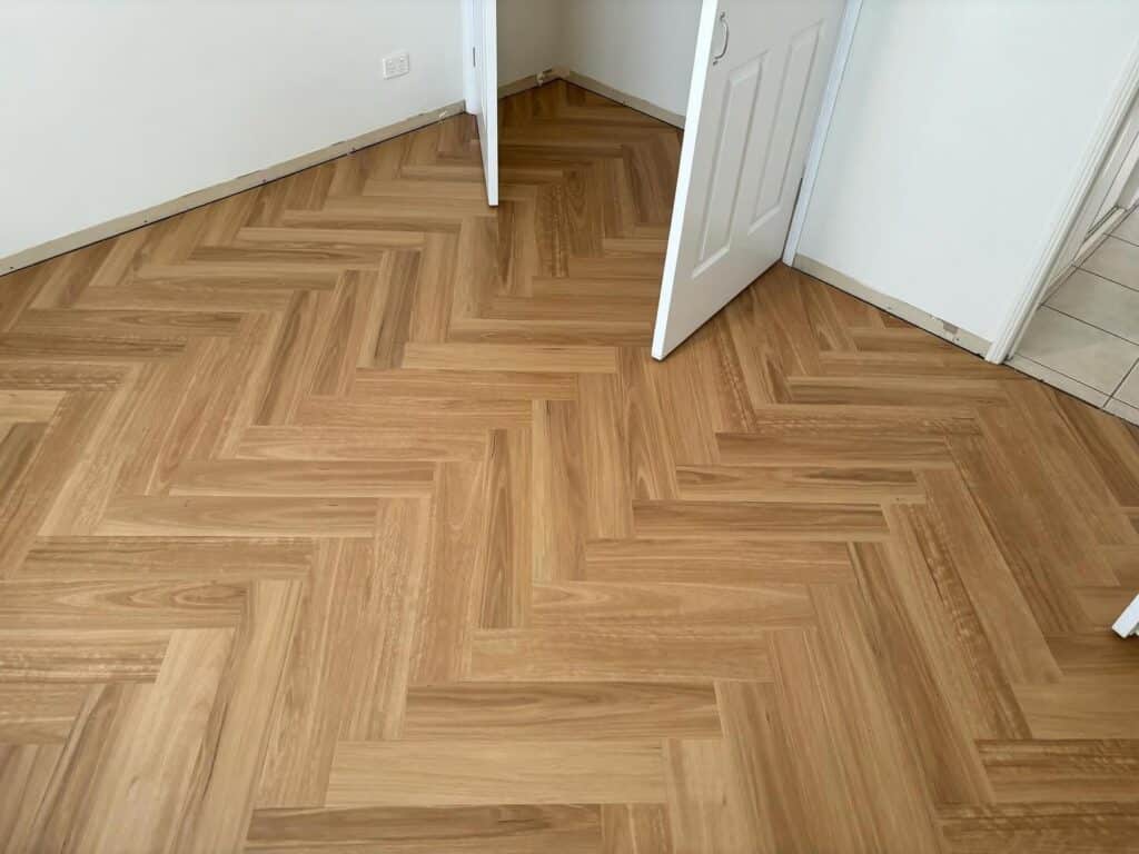 A Room With Herringbone Hybrid Flooring