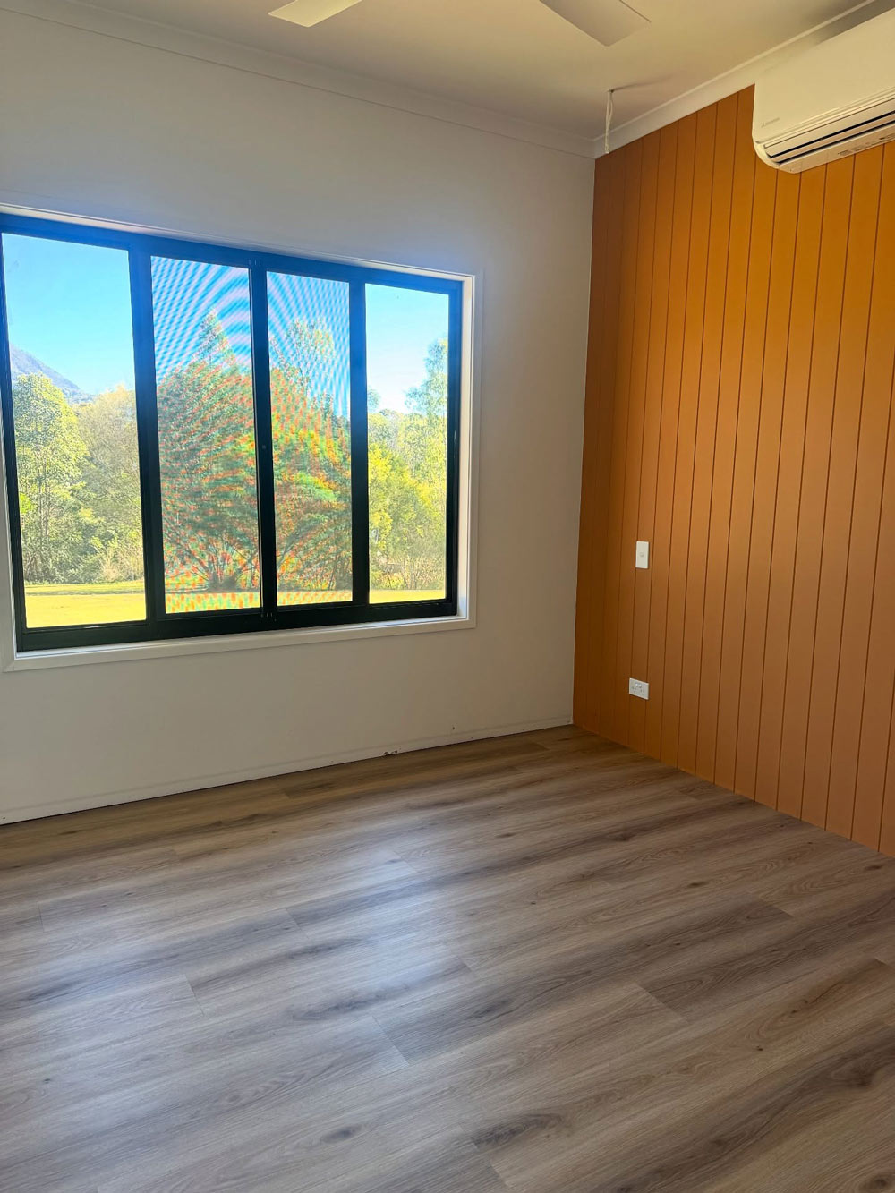 An Empty Room With Timber Flooring
