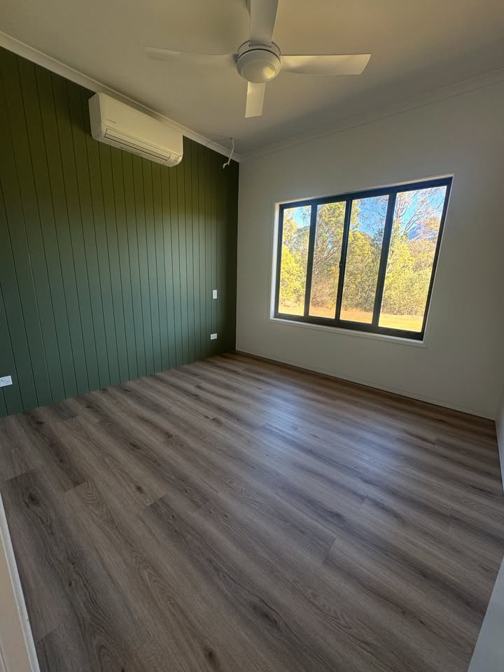 Empty Room with Timber Flooring and Glass Windows