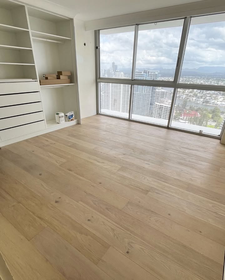 Installed Timber Flooring on A Room with Glass Walls