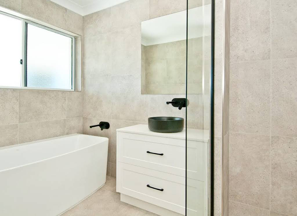 Bathroom with Beige Wall Tiles Installed