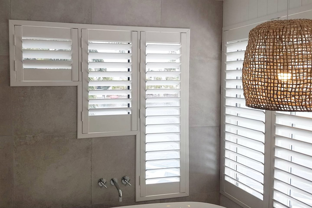 Installed Tiles Around the White Shutters