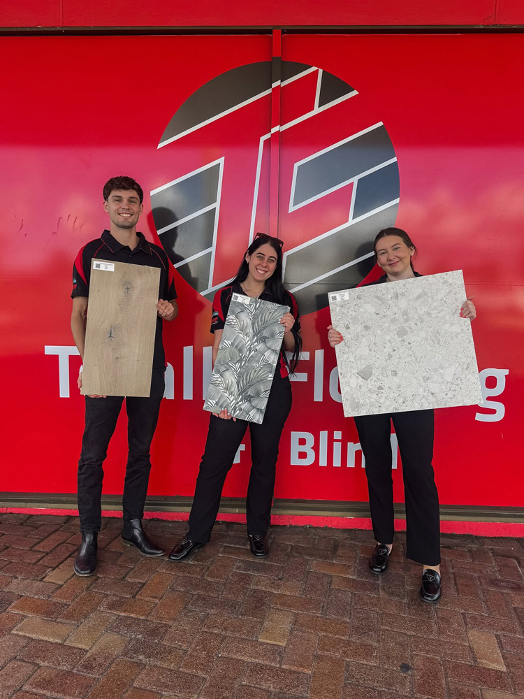 Totally Flooring Members Holding Tiles On The Gold Coast