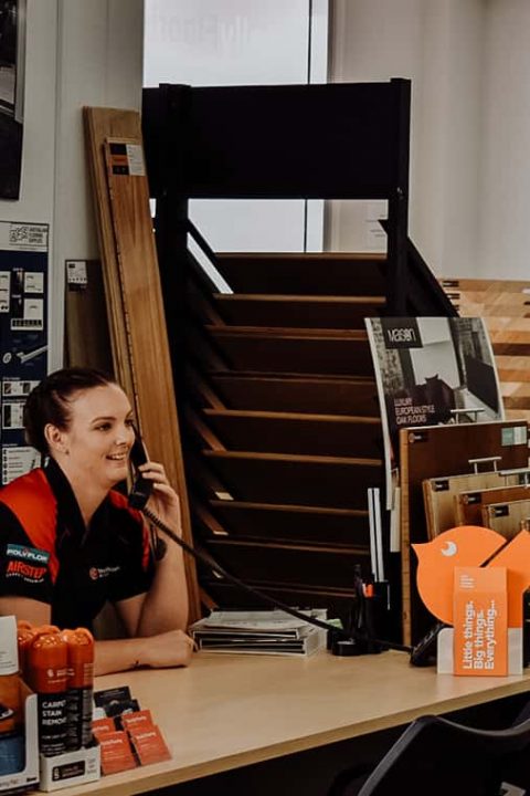 Staff talking on phone — Totally Flooring In Gold Coast, QLD